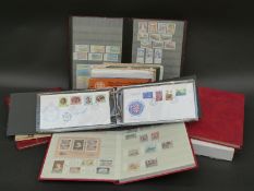 An extensive collection of mint Channel Island stamps in stockbooks and packets,
