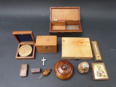 A collection of small boxes and other wooden items to include a pewter covered Arts and Crafts