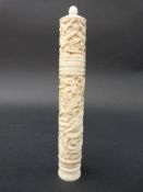 A 19thC carved bone needle case decorated with dragons,