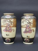 A pair of Japanese Satsuma vases decorated with geishas playing musical instruments,