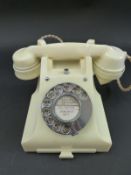 A white bakelite GPO 300 telephone