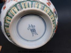 A Chinese famille verte bowl with underglaze Kangxi mark to the base,