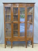 A mahogany bow fronted display cabinet with three drawers below (W123 x D34 x H186cm)