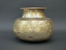 An Eastern engraved brass water vessel,