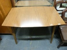 A retro formica extending table and four chairs.