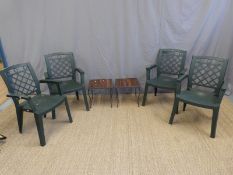 A pair of wrought iron and mahogany garden tables and four chairs