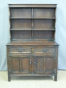 An oak dresser with plate rack to top and cupboards and drawers below (W121 x D51 x H183cm)