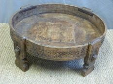 An eastern circular low table,