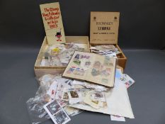 A very large quantity of loose all world stamps in packets, tins etc.