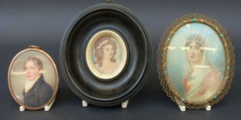 Three portrait miniatures comprising an ivory and ebony framed example marked verso Mrs Maurroch,