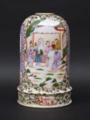 A 19th century Chinese porcelain bell shaped forcer decorated with court scenes,