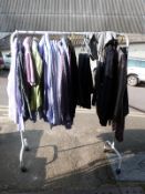 Over twenty items of clothing consisting of mens suits, shirts, knitwear, ties etc some with Next,
