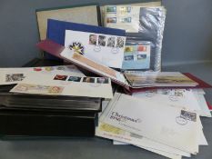 A quantity of first day covers in albums,
