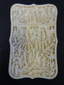 A Chinese Canton carved ivory card case decorated with court scenes, 10.7x6.7x1.