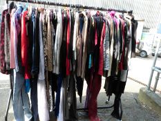 Over one hundred and twenty items of clothing consisting of knitwear, dresses,