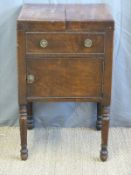 A Georgian mahogany washstand/bedside cabinet with hinged flaps to top and cupboard to base (W48 x