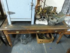 An early 20thC leather inset pitch pine three drawer desk/table