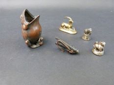 An oriental bronze frog and locust ornament and three further brass examples