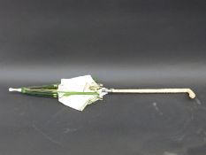 A 19thC parasol with Chinese Canton carved ivory handle with dragon, bird and foliate design,