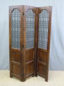 An Eastern hardwood folding screen with decorative inset metal grilles,