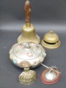 An Eastern jewelled white metal casket containing costume jewellery together with a brass hand bell,