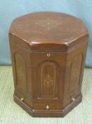 A brass inlaid octagonal drinks cabinet with hinged lid, lift out tray and three drawers,