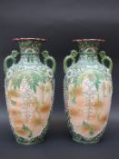 A pair of Japanese vases with raised and pierced decoration of flowers and gilt mark to bases,