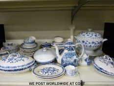 A large collection of blue and white ceramics including Spode and a large creamware candlestick