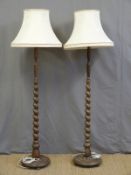 A pair of barley twist oak standard lamps
