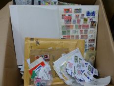 A box containing various albums and loose stamps, including 1st day issue, world, British,