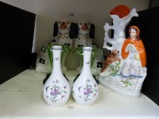 A pair of Staffordshire mantel dogs, spill vase,