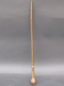 A late 19thC / 20thC rhino horn riding crop or knobkerrie with white metal collar in the form of a