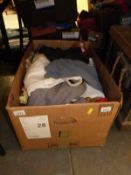 A box containing boots and items of clothing