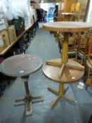 A cast iron pub table with copper top and two others
