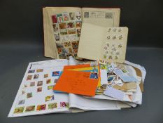 A Triumph album of all world stamps and sundry loose stamps,