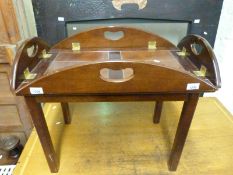 A butler's tray on stand with folding flaps