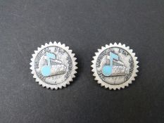 Two Musical box society badges decorated with a cylinder and a blue enamel musical note
