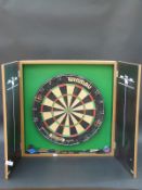 A Winmau dart board in case