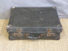 A vintage leather bound suitcase,