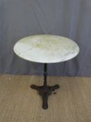 A cast iron pub/ outdoor circular table