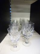 Two sets of six wine glasses