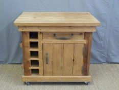 A pine kitchen island unit fitted with drawers,