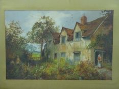 An oil on board of a cottage with figure on path in gilt frame,