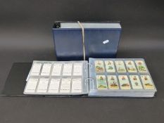 Two albums of cigarette and other card sets to include Wills Players,