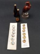 Two sets of reverse painted Guinness buttons,