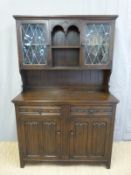 A glazed and linenfold oak dresser,