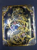 A Victorian papier mache scrap album with mother of pearl inlay dated 1857 with armorials,