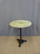 A cast iron pub/ outdoor circular table