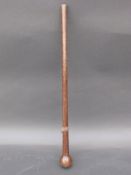 A zebrawood knobkerrie with leather collar,