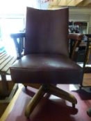 A retro faux leather office or captain's swivel chair